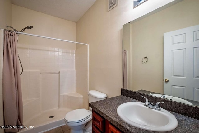 bathroom featuring a shower with curtain, toilet, tile patterned floors, and vanity