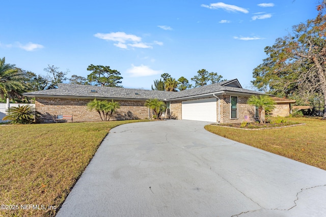 single story home featuring a garage and a front yard