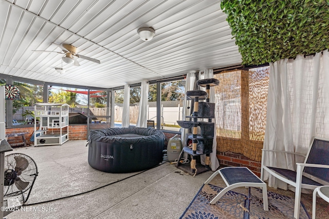 sunroom / solarium with ceiling fan