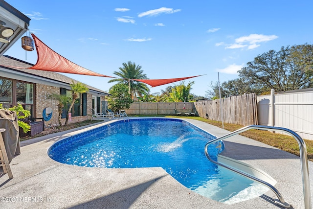 view of swimming pool featuring a patio area