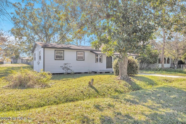 view of front of property with a front lawn