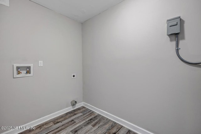 washroom with hookup for a washing machine, wood-type flooring, and hookup for an electric dryer