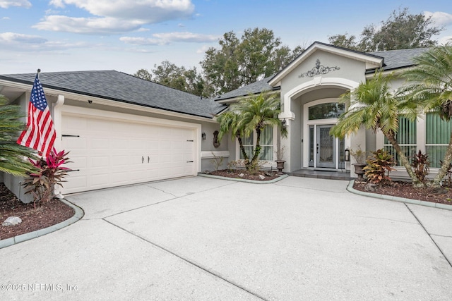 view of front of property with a garage