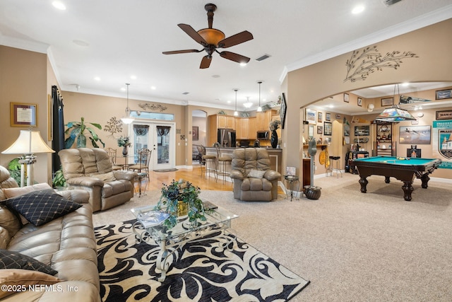 carpeted living room with billiards, ornamental molding, french doors, and ceiling fan