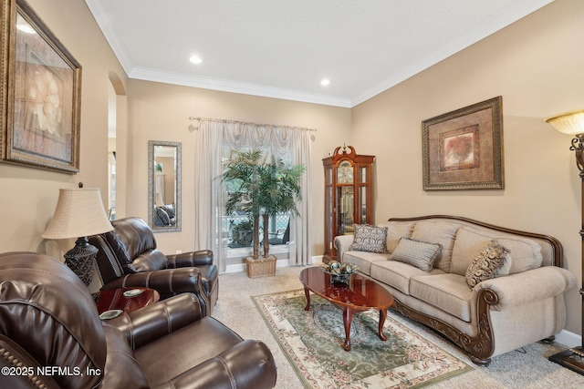 carpeted living room featuring ornamental molding