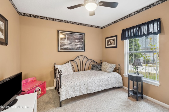 bedroom featuring multiple windows, carpet, and ceiling fan