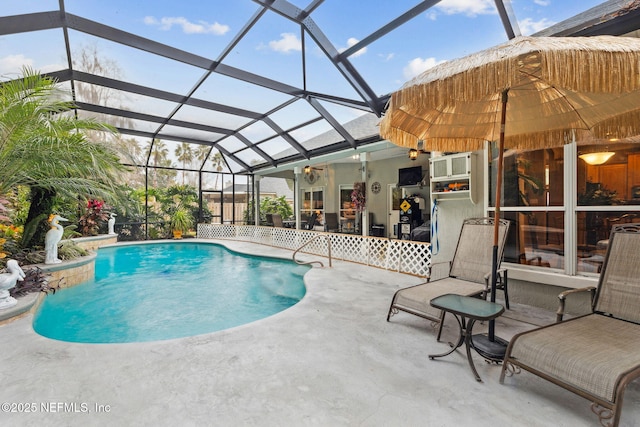 view of swimming pool featuring ceiling fan, a lanai, and a patio