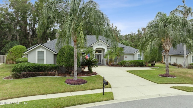 single story home featuring a front yard