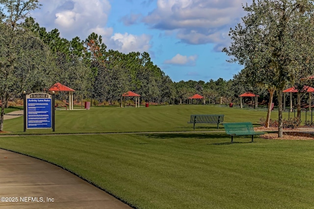 surrounding community with a gazebo and a lawn