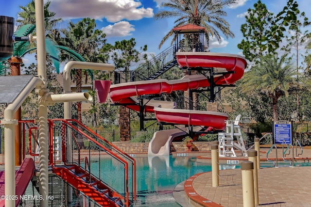 view of playground featuring a community pool