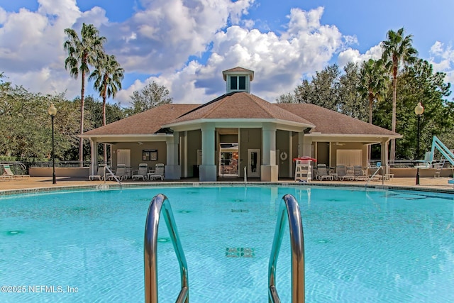 view of swimming pool with a patio area