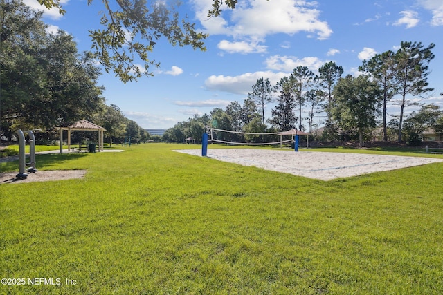 view of community featuring a gazebo, volleyball court, and a lawn