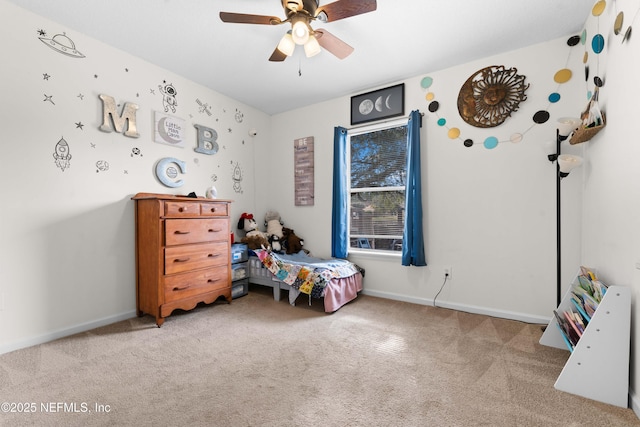 bedroom featuring light carpet, ceiling fan, and baseboards