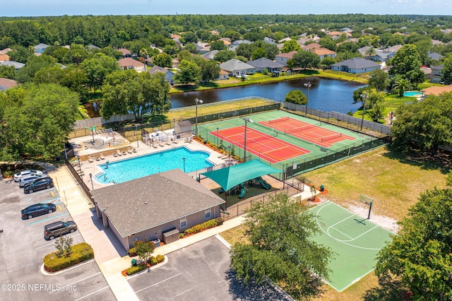 birds eye view of property with a water view