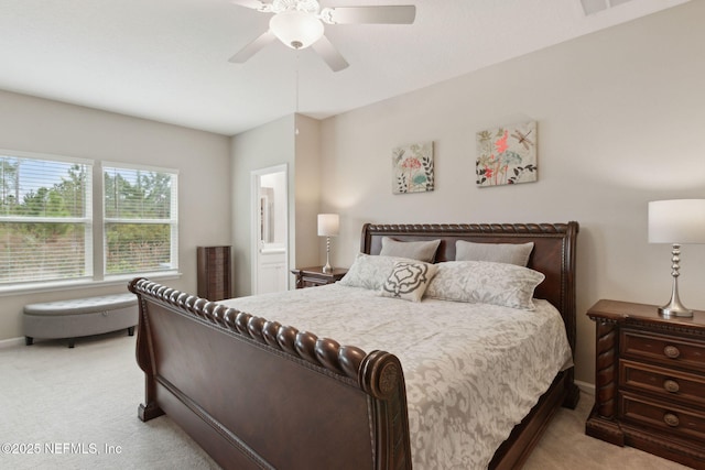 bedroom with a ceiling fan and light colored carpet