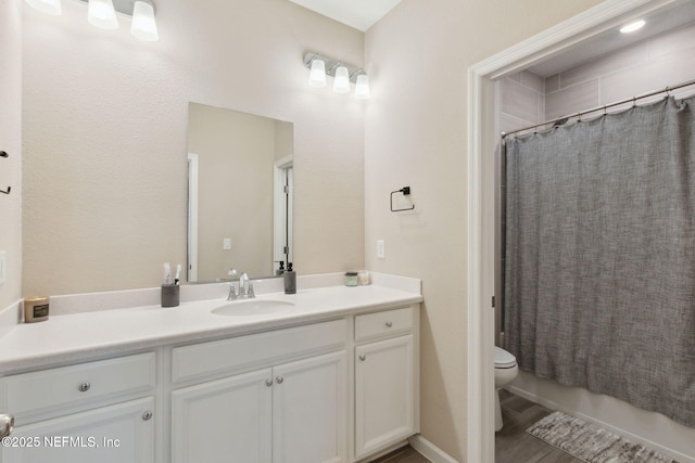 full bath with toilet, shower / bath combo, and vanity