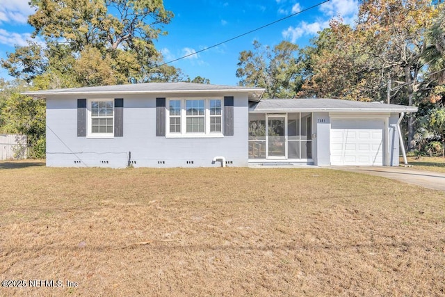 view of front of home with a garage and a front lawn