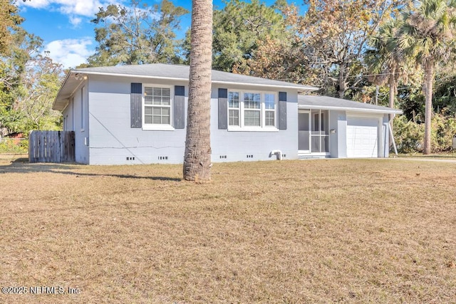 view of front of house with a garage and a front lawn