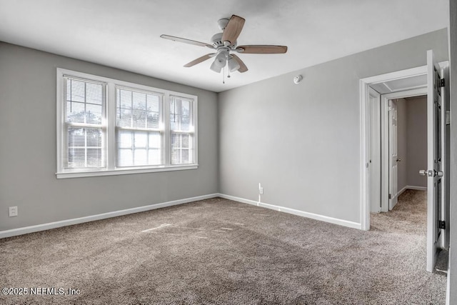 spare room with carpet flooring and ceiling fan