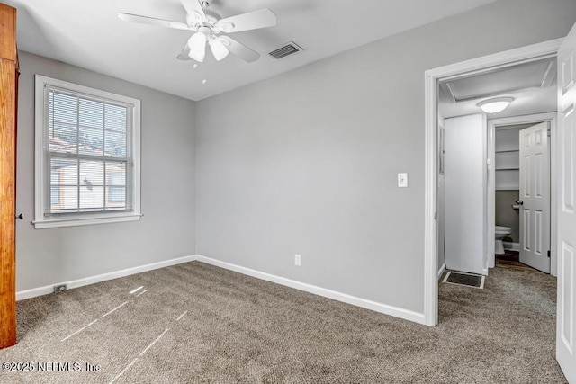 empty room featuring carpet floors and ceiling fan