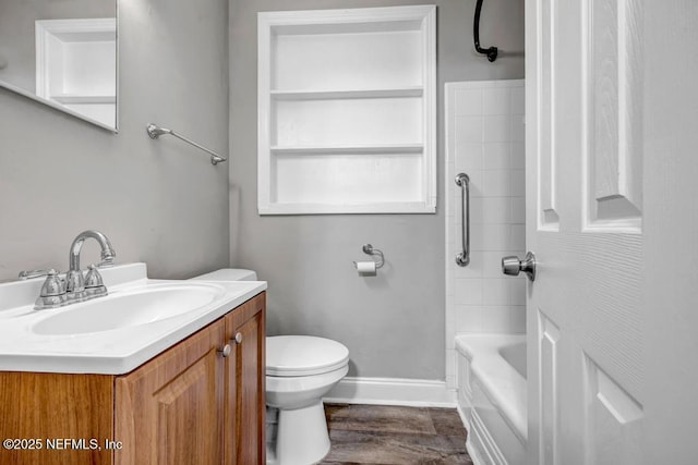 full bathroom featuring vanity, wood-type flooring, tub / shower combination, and toilet