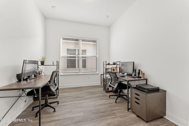 office space with light wood-type flooring