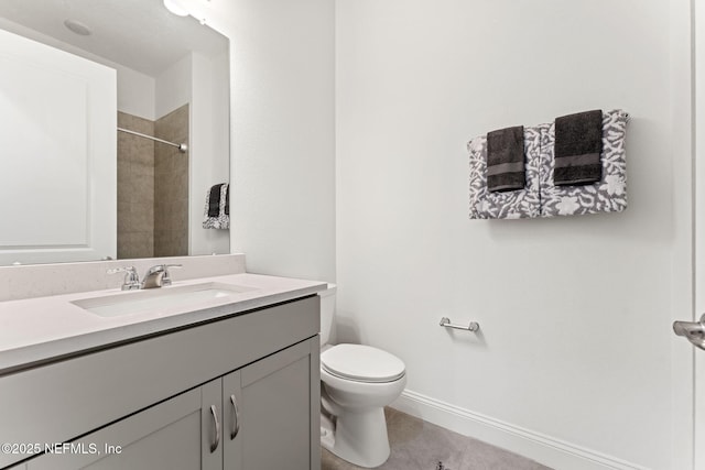 bathroom featuring tile patterned floors, vanity, and toilet