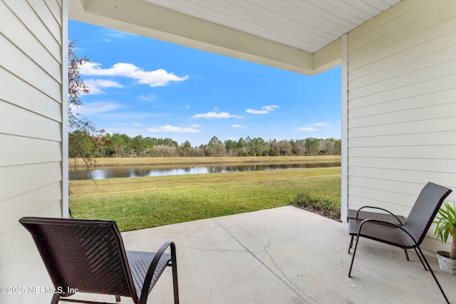 view of patio / terrace with a water view