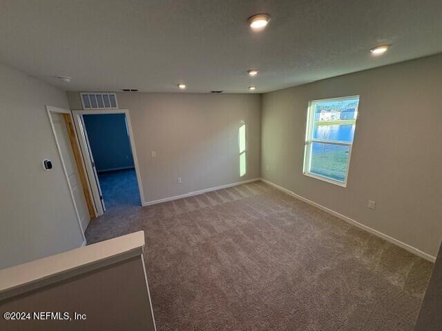 empty room featuring carpet