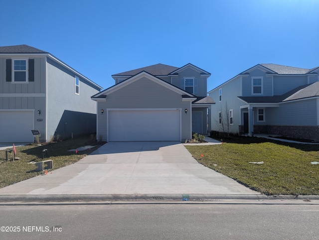 front of property featuring a front yard and a garage