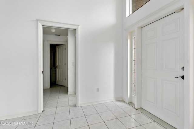 entrance foyer with light tile patterned floors