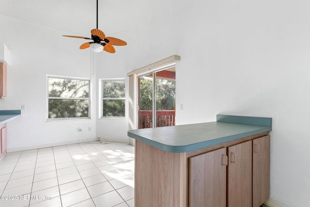 unfurnished sunroom featuring ceiling fan and vaulted ceiling