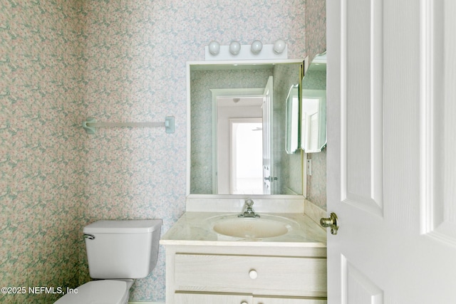 bathroom with vanity and toilet