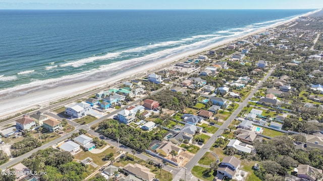 drone / aerial view with a view of the beach and a water view