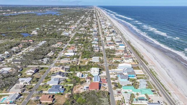 bird's eye view with a water view and a view of the beach