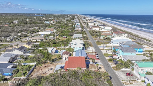 aerial view with a water view and a view of the beach