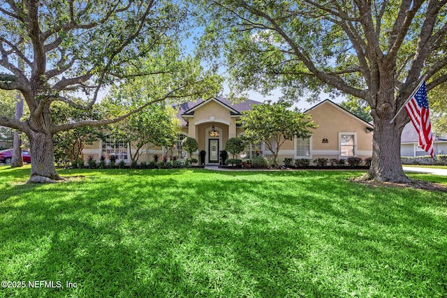 ranch-style home featuring a front lawn