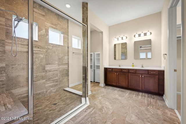 bathroom featuring vanity and a tile shower