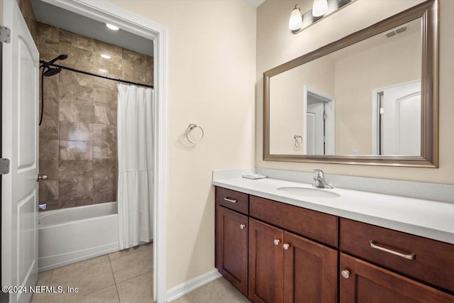 bathroom featuring tile patterned flooring, vanity, and shower / bathtub combination with curtain