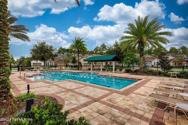 view of swimming pool featuring a patio area