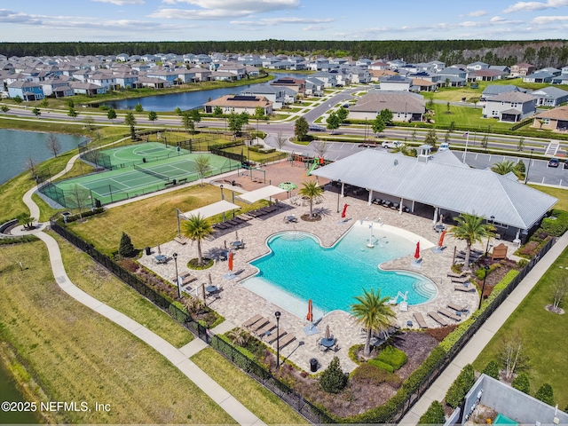 birds eye view of property featuring a water view