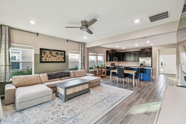 living room featuring ceiling fan