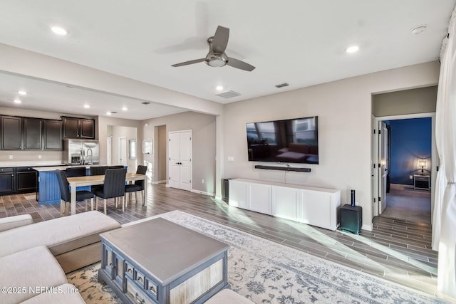 living room with ceiling fan