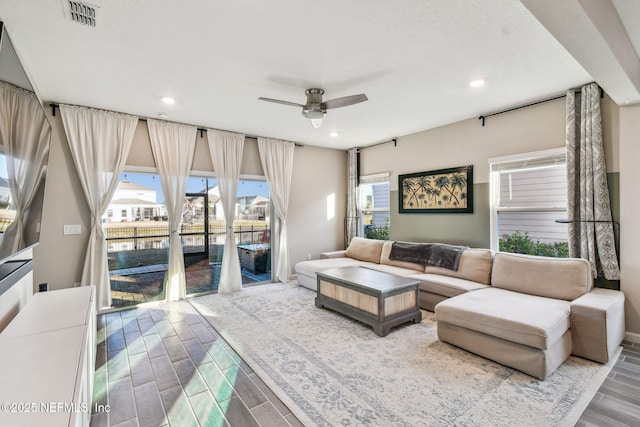 living room with ceiling fan