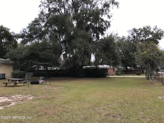 view of yard with central air condition unit