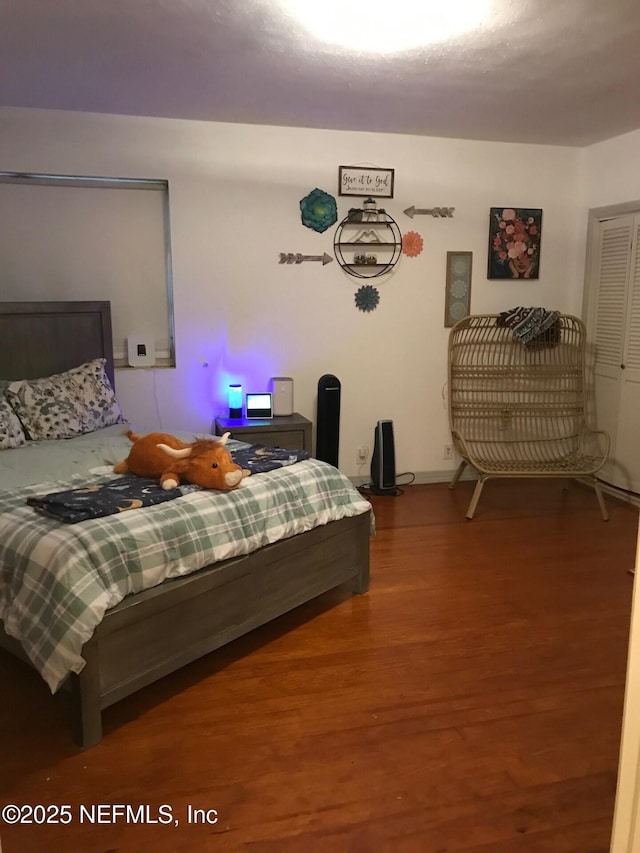 bedroom featuring hardwood / wood-style flooring