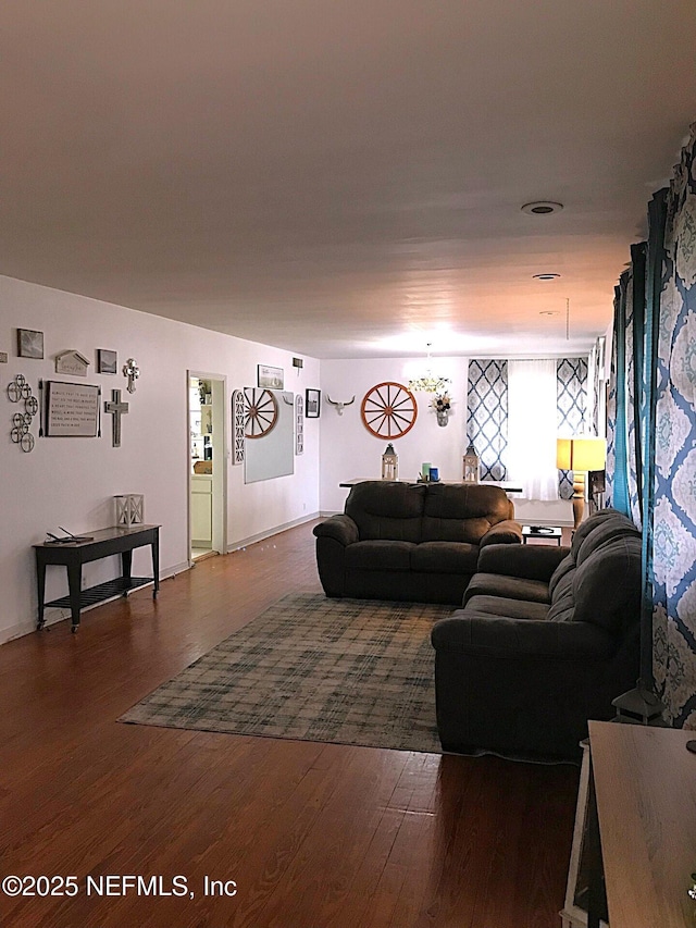 living room featuring dark wood-type flooring