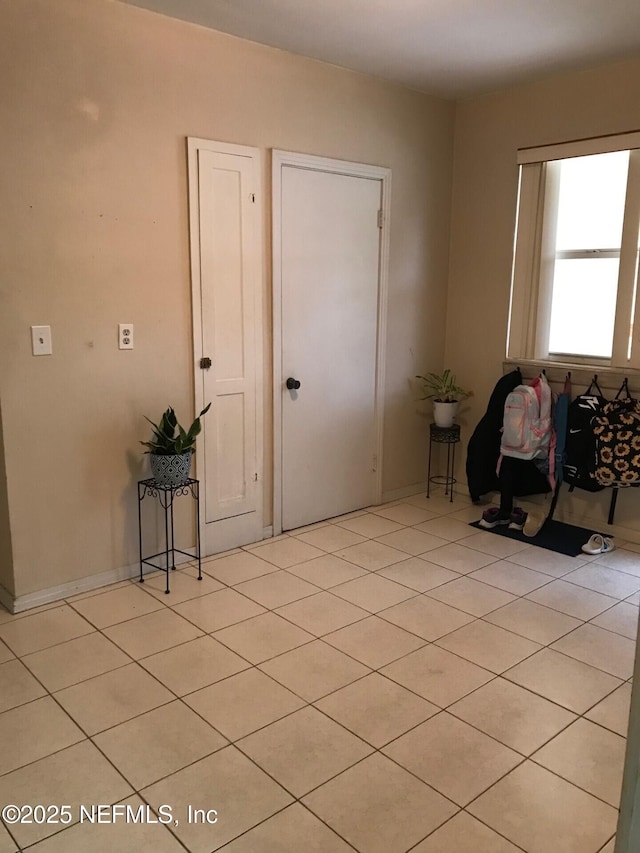 entryway featuring light tile patterned floors