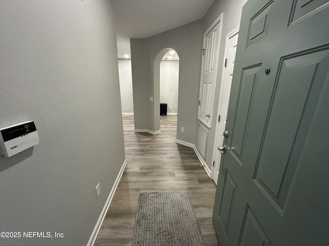 hallway featuring dark wood-type flooring