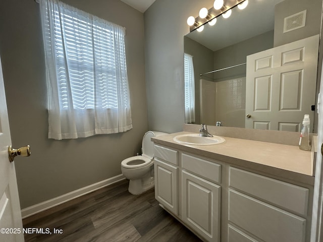 7801 Point Meadows Dr Unit 1101, Jacksonville, FL 32256 - bathroom with hardwood / wood-style flooring, toilet, vanity, and walk in shower